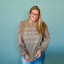 Load image into Gallery viewer, Model wearing the Body Positivity crew sweatshirt in coffee brown, front view full