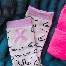 Load image into Gallery viewer, Pair of socks with pink ribbons and pink cuffs on a dark background