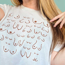 Load image into Gallery viewer, Person wearing a white tank top with design against a light blue background