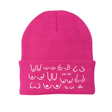 Load image into Gallery viewer, Pink breast cancer awareness beanie with white patterns on a white background