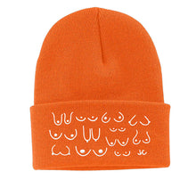 Load image into Gallery viewer, Orange beanie with white patterns on a white background