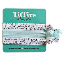 Load image into Gallery viewer, Set of 3 hair tie bracelets with mint hair tie in the middle on a teal card