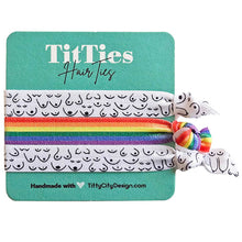 Load image into Gallery viewer, Set of 3 hair tie bracelets with rainbow colored hair tie in the middle on a teal card
