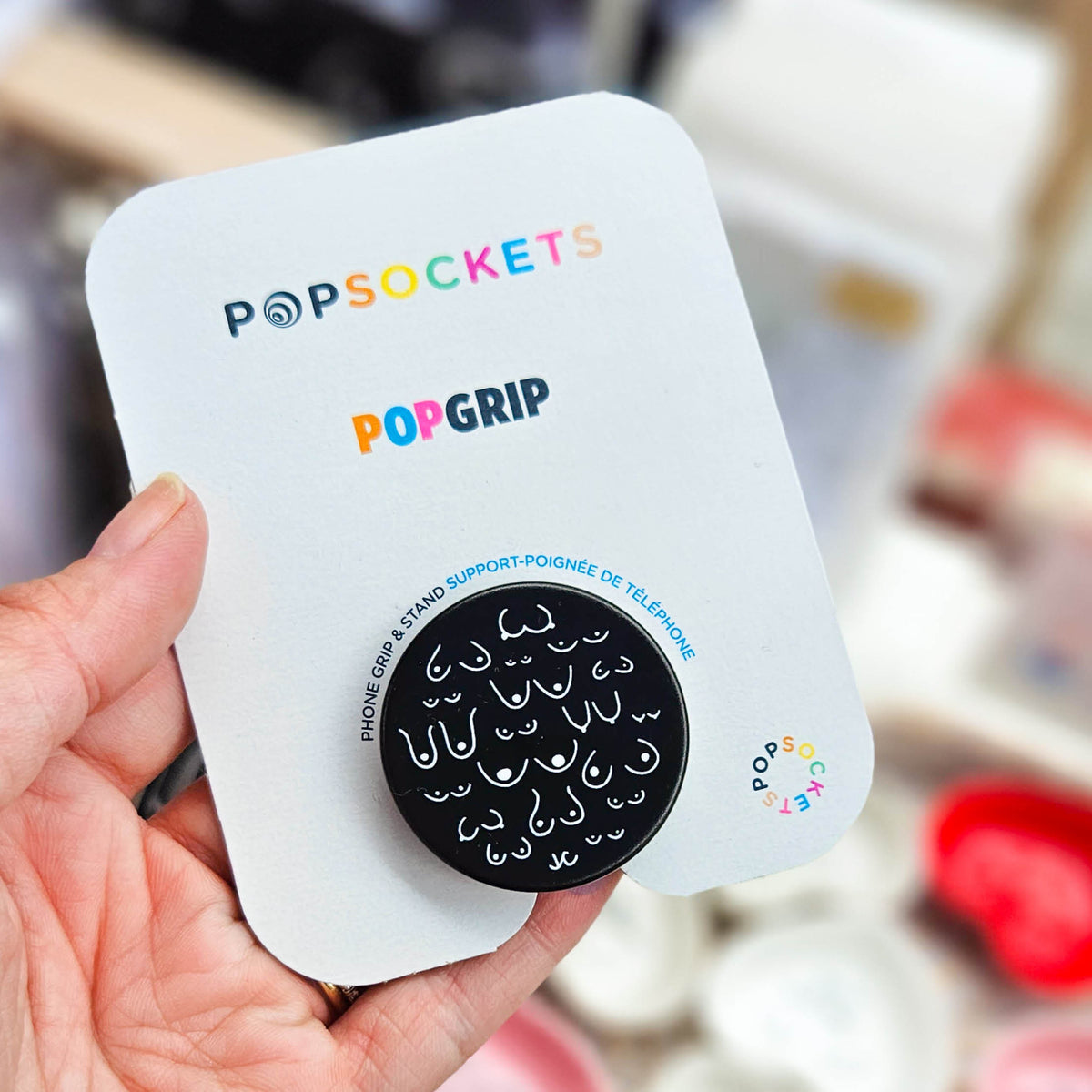 Photo of Titty City Black Pop Socket PopGrip in packaging 