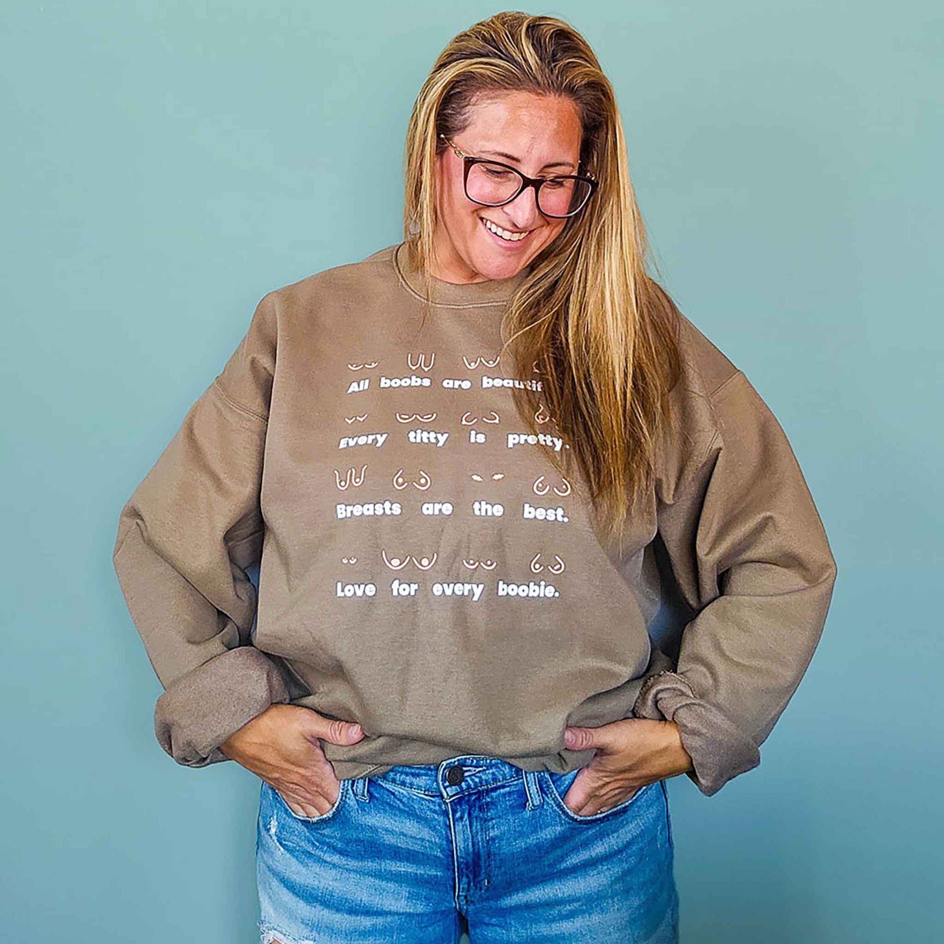 Model wearing the Body Positivity crew sweatshirt in coffee brown, front view