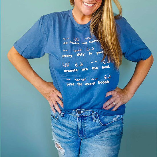 Close up of model wearing the Body Positivity T-Shirt in blue jean, front view, styled casually with jeans showing relaxed fit