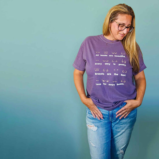 Model wearing the Body Positivity T-Shirt in plum purple, front view, styled casually with jeans showing relaxed fit