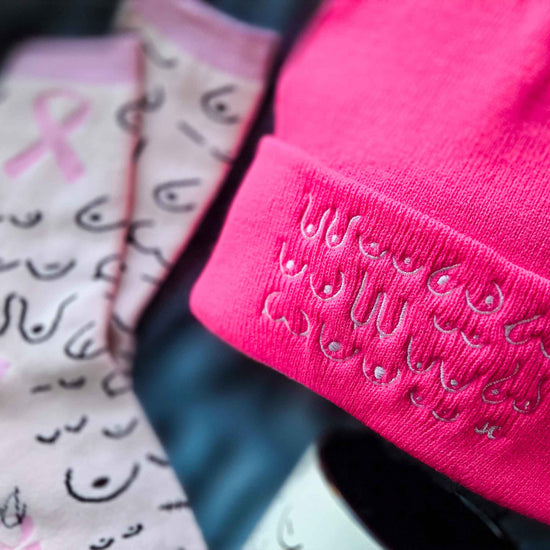 Close-up of pink bandanas with black patterns on a blurred background