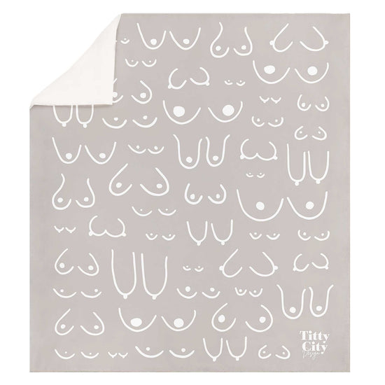 Gray blanket with white abstract pattern and 'Titty City' branding