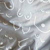 Gray blanket with white abstract patterns