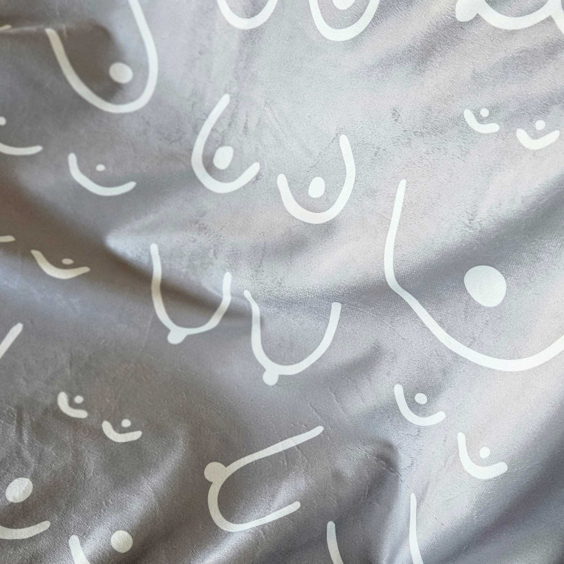 Gray blanket with white abstract patterns