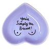 and-painted heart-shaped ceramic jewelry dish with fun phrase in lavander