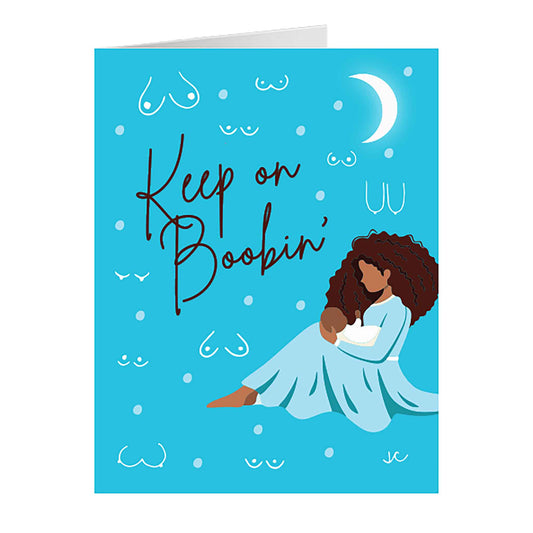 Front of blue Keep on Boobin' greeting card with image of new mom holding baby at nighttime 