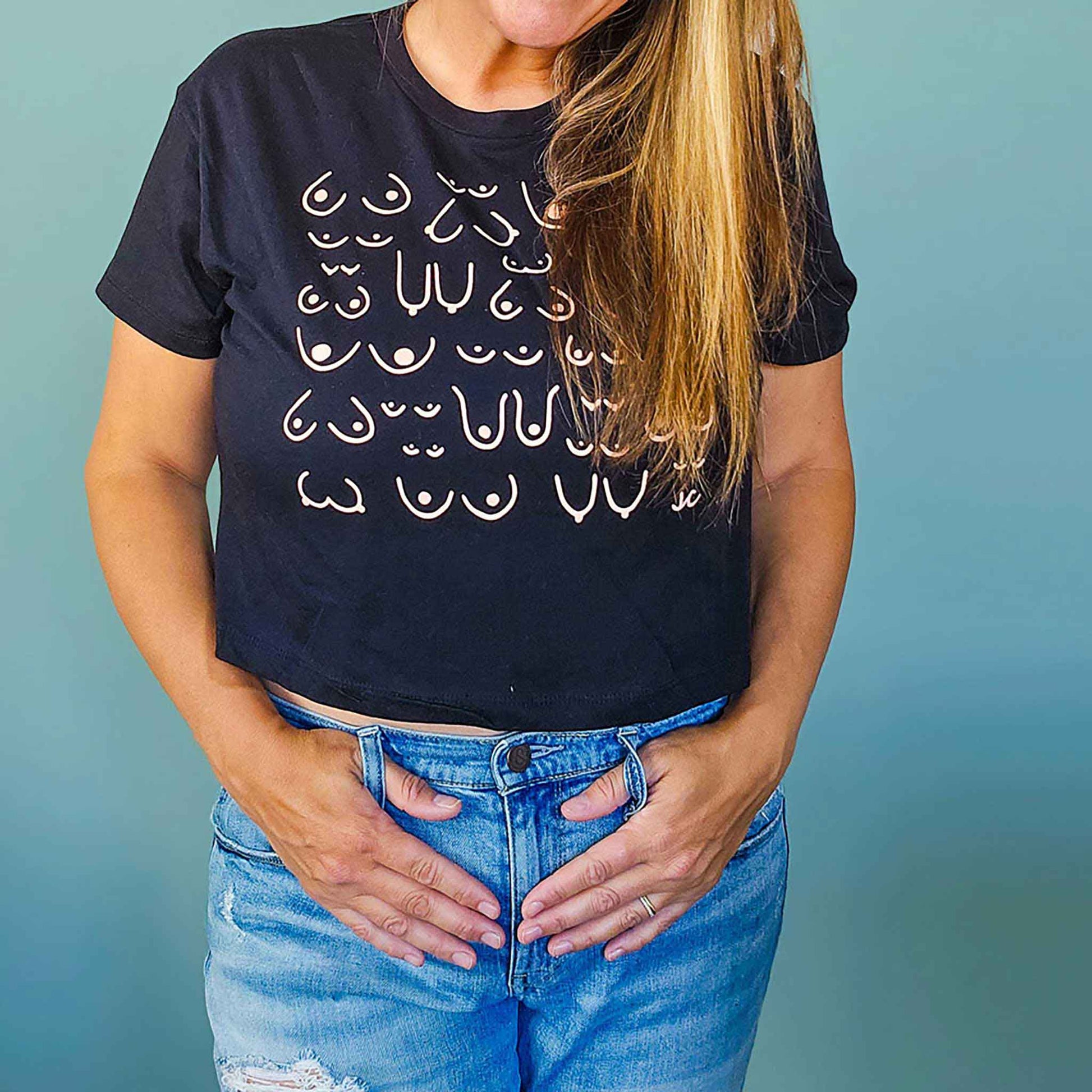 model wearing the self love club cropped tee in black, front view, close up