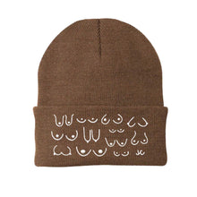 Load image into Gallery viewer, Brown beanie with white pattern on a white background
