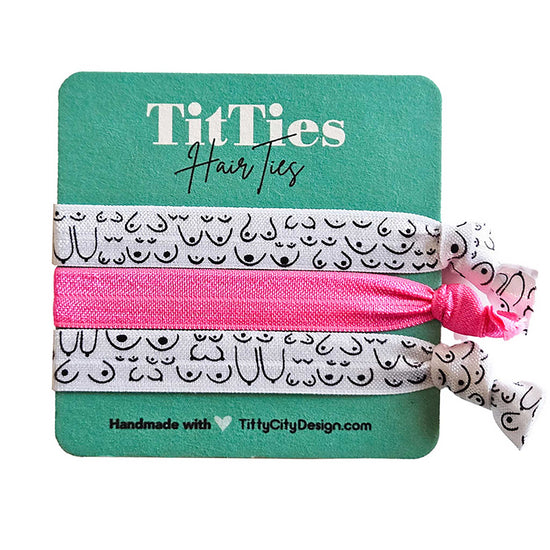 Set of 3 hair tie bracelets with bright pink hair tie in the middle on a teal card 
