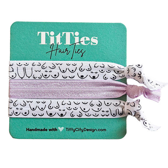 Set of 3 hair tie bracelets with lilac purple hair tie in the middle on a teal card 