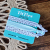Tie-Ties hair ties on a branded card with jute twine in the background