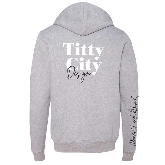 Titty City brand zip-up hooded sweatshirt in gray with logo on center back and slogan on right sleeve, back view