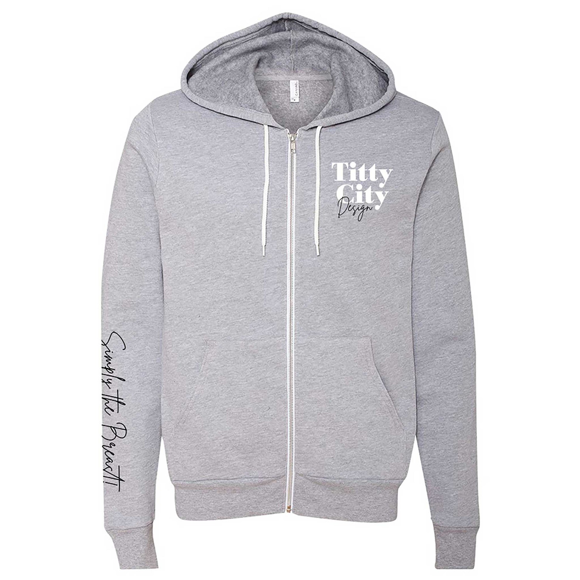 Titty City brand zip-up hooded sweatshirt in gray with logo on left chest and slogan on right sleeve, front view
